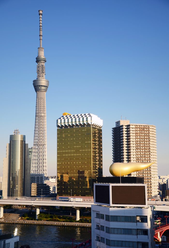 Tokyo Skytree and nearby buildings viewed from the river, highlighting private guided tours and places GoWithGuide recommends for one day in Tokyo.